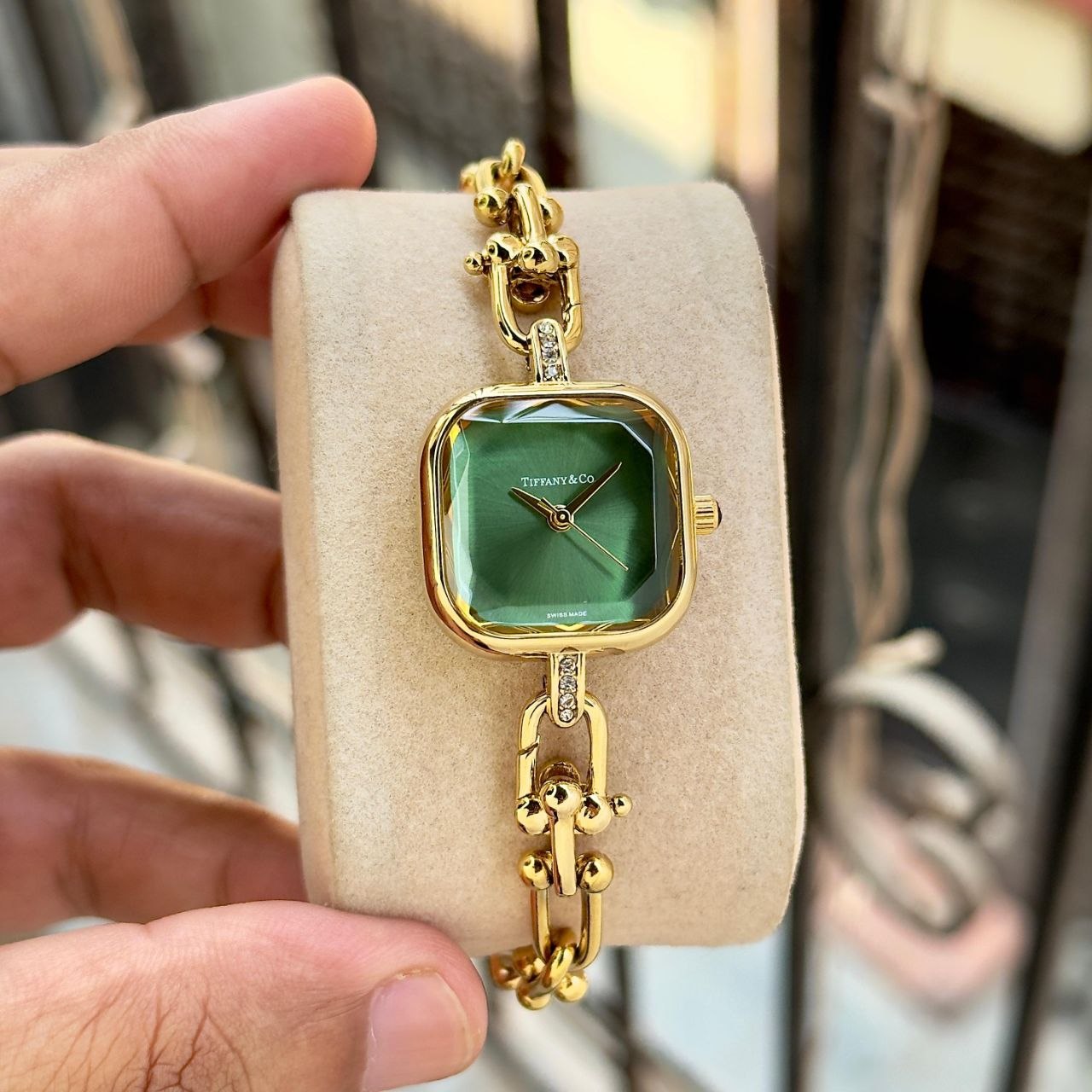 Tiffany & Co. HardWear Women’s Watch featuring a pearl white sunray dial, gold-tone HardWear link bracelet, elegant square case, diamond-style accents, and luxury-inspired feminine styling. Tiffany & Co. HardWear Women's Watch – Pearl White Dial with Gold-Tone Bracelet & Elegant Square Case