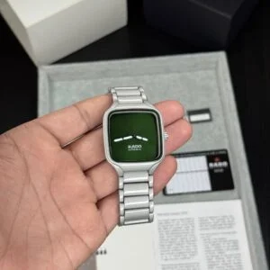 Rado True Square men's watch featuring a premium green dial, sapphire crystal glass, grey strap, quartz movement, and modern square case design with luxury-inspired styling.