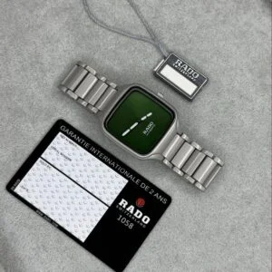 Rado True Square men's watch featuring a premium green dial, sapphire crystal glass, grey strap, quartz movement, and modern square case design with luxury-inspired styling.